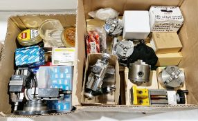 Two boxes of lathe and other machine tool accessories and tools including seven various chucks, a