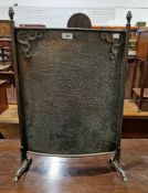 Early 20th century Arts & Crafts copper firescreen, with flame cast supports, applied with