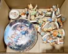 Collection of Goebel figures of children and four Hummel collection plates including plate no.11511,