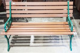 Cast iron and wooden slat garden bench, 123cm wide