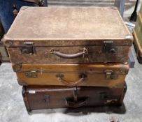 Three vintage suitcases including a wood and metal bound example and a selection of textiles
