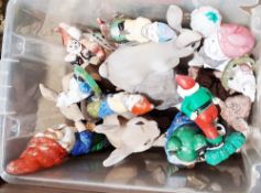 Four boxes and chest of drawers containing an assortment of garden animals, figures and gnomes