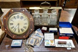 20th century brass-mounted three-bottle tantalus housing three moulded glass decanters, 36cm wide,