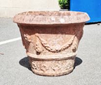 Large terracotta plant pot decorated with foliate swags, 44cm high x 57cm diameter