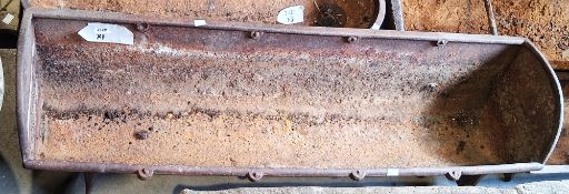 Large cast iron feeding trough, tapering sides and curved ends, 123cm long x 35cm wide