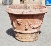 Large terracotta plant pot decorated with foliate swags, 43cm high x 57cm diameter