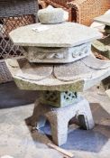 Three similar six-piece Japanese-style stone garden pagodas, hexagonal in design, 63cm high (3)