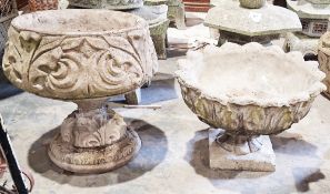 Two reconstituted stone planters on stands, one squat round with foliate decoration, 45cm diameter x