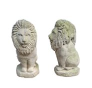 Pair of pale stone carved lions 'Sejant', 52cm high (2)