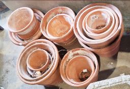 Quantity of vintage terracotta plant pots of varying sizes