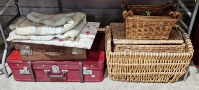 Three wicker baskets, a wicker hamper, two vintage suitcases and other items