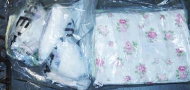 Four bags of assorted fabrics including various floral examples, an animals in hot air balloons sect