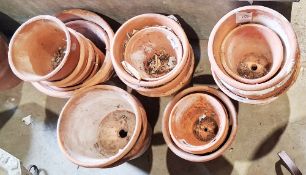 Quantity of vintage terracotta plant pots of varying sizes