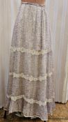 An Edwardian chiffon skirt, pale purple with lace bands and slight train, possibly to accommodate