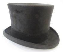 Black silk top hat labelled Lock & Co, Haters, St James London in a James Lock & Co Limited