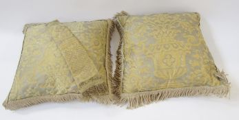 Pair of silk backed Fortuny cushions with cream coloured braid detail, one narrow tie back/