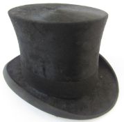 A black silk top hat labelled Lincoln Bennett Burlington Gardens Old Bond Street, in a hat box