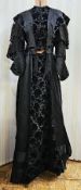A black Victorian probably mourning dress, with cut velvet detail to the inner bodice, appliqued