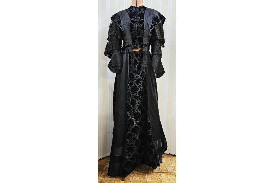 A black Victorian probably mourning dress, with cut velvet detail to the inner bodice, appliqued - Image 1 of 15