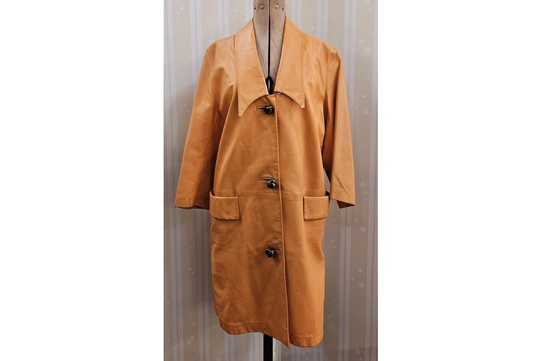 Vintage 1970's orange leather coat, three-button metal fastening, pockets and a shawl collar, and - Image 1 of 4
