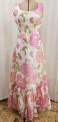 1960's maxi dress labelled Montigo ( sic) Bay, white ground printed with green and pink with a