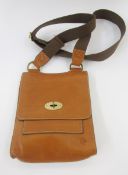 A tan leather Mulberry messenger bag, brass hardware, Mulberry logo lining, interior zipped