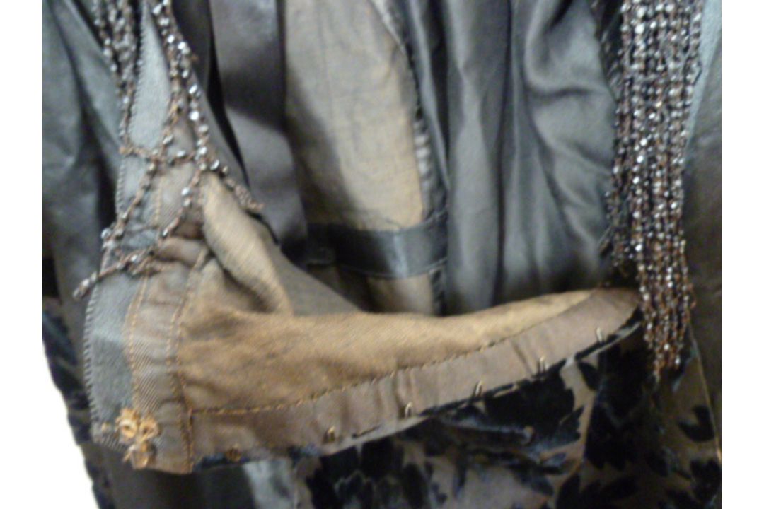 A black Victorian probably mourning dress, with cut velvet detail to the inner bodice, appliqued - Image 10 of 15
