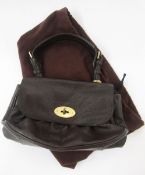 A vintage brown leather Mulberry bag with single strap handle, lining printed with the Mulberry