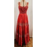 A 1970's crochet and cheesecloth maxi dress, with a crochet rose to the bodice and lace detail to