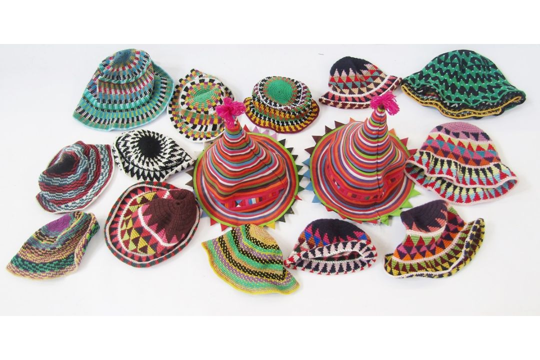 Two cotton tie carnival hats and a quantity of ethnic crocheted bucket hats in various sizes and - Image 1 of 2