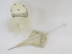 A 1920's wedding headdress, glass bead decoration, and a Edwardian cream linen parasol trimmed