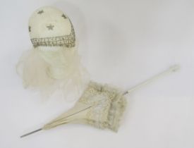 A 1920's wedding headdress, glass bead decoration, and a Edwardian cream linen parasol trimmed