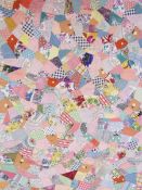 1940's patchwork quilt, small double size, vintage fabrics throughout, and backed with pink cotton