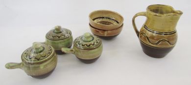 Six Sidney Tustin Winchcombe items to include jug with yellow and brown glaze, wave decoration, 16.