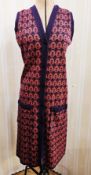 A knitted sleeveless acrylic dress in purple and reds labelled Irvin Sellars, could be a pinafore