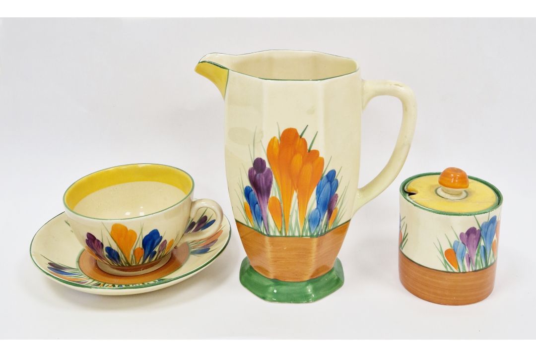 Clarice Cliff 'Crocus' pattern jug (15.5cm high), a cup & saucer and a lidded preserve jar (lid - Image 6 of 10