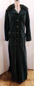 A full length bottle green velvet coat, with fox fur collar, circa 1970, labelled Mansfield, size 12