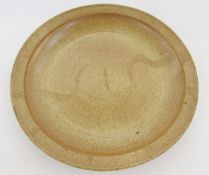 Ray Finch (1914-2012) for Winchcombe stoneware charger, speckled ground with incised wave