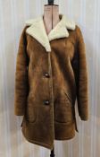 A ladies' sheepskin gilet, labelled Genuine Lambskin Niche Sheepskin Accessories, size small, and