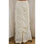 A ruched open weave cotton Edwardian walking skirt with small train, a white Victorian petticoat