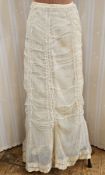 A ruched open weave cotton Edwardian walking skirt with small train, a white Victorian petticoat