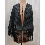 Victorian black satin cape with passementerie braid details and deep fringe, a satin underdress, a