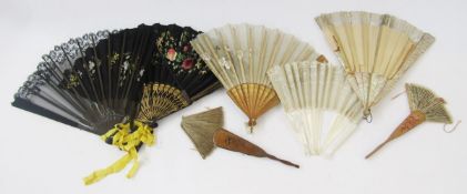 Black painted satin fan with gilt decorated guards and sticks, a wooden painted fan with mother-of-