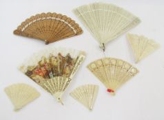 Various carved bone Chinese fans, a carved wooden fan, a silk and lace fan with tiny sequins, bone