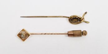 Gold-coloured metal and white stone stickpin, pierced offset square with white stone and another