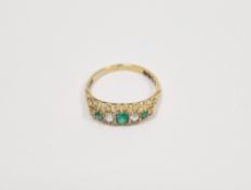 Late 19th/early 20th century 18ct gold, emerald and diamond ring, the three rectangular emeralds