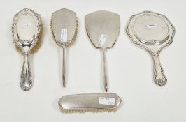 Edward VII silver-mounted hand mirror and matching silver hairbrush, Birmingham 1908 and 1909, of