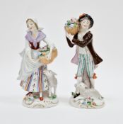 Pair of Sitzendorf porcelain figures, one of a lady holding a basket of flowers beside a lamb, the