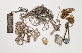 Silver ingot pendant, two silver pierced pendant fobs circa 1920, a silver rope-pattern chain and