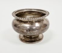 George V silver salt of compressed globular footed form, with gadrooned rim,  hallmarked London,